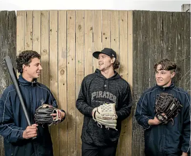  ?? BRADEN FASTIER/STUFF ?? Pittsburgh Pirates pitcher Steven Brault chats with Cooper Grant, left, and Reegan Lawton during his visit to Nelson College.