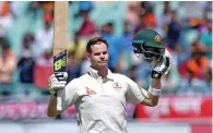  ?? – PTI ?? THIRD TON OF SERIES: Australia’s captain Steve Smith celebrates after completing his century during the first day of their fourth Test match against India in Dharamsala on Saturday.