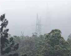  ?? ?? Mist surroundin­g powerlines at Clagiraba. Picture: Glenn Hampson