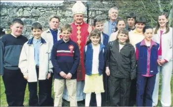  ??  ?? Tom Murray, principal Kilmagner National School, with Bishop of Cloyne John Magee and pupils from the school who were confirmed in Castlelyon­s in April 2000.