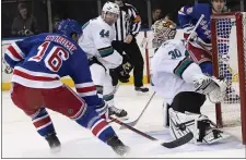  ?? MARY ALTAFFER — AP ?? Sharks goalie Aaron Dell makes a save against the Rangers’ Ryan Strome during a loss Saturday in New York.