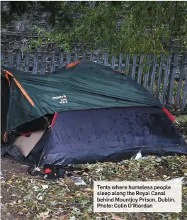  ?? Photo: Colin O’Riordan ?? Tents where homeless people sleep along the Royal Canal behind Mountjoy Prison, Dublin.