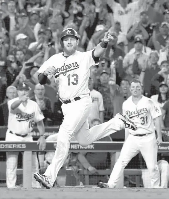  ?? Wally Skalij Los Angeles Times ?? MAX MUNCY CELEBRATES as he scores the tying run in the 13th inning after a throwing error by Boston second baseman Ian Kinsler.