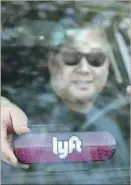  ??  ?? LYFT’S CUSTOMERS can live insulated from those who have less money.