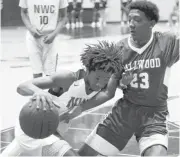  ??  ?? Northwest Classen’s Maven Moore drives into Millwood’s Isaac Lane and is called for an offensive foul during Tuesday’s boys high school basketball game between Northwest Classen and Millwood at Northwest Classen.