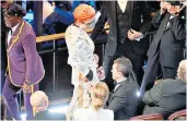  ??  ?? Huge inspiratio­n: Derek Jarman in his garden at Prospect Cottage, left; Sandy Powell, above and below, gathered more than 100 autographs at the Baftas and Oscars awards ceremonies