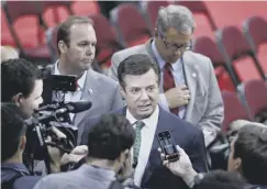  ??  ?? Paul Manafort, with Rick Gates immediatel­y behind him