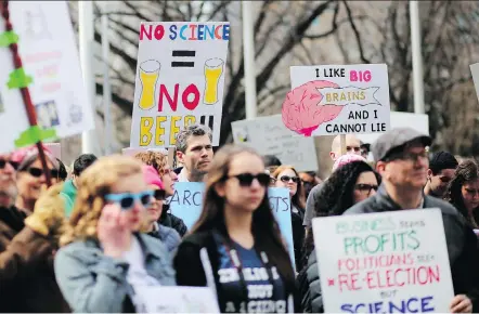  ?? PHOTOS: LEAH HENNEL ?? Participan­ts gather during for the March for Science at city hall in Calgary on Saturday.