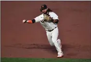  ?? JOSE CARLOS FAJARDO — BAY AREA NEWS GROUP ?? The Giants’ Brandon Crawford throws out the Dodgers’ Justin Turner at first base in the second inning of Game 5 of the NLDS at Oracle Park in San Francisco on Thursday.