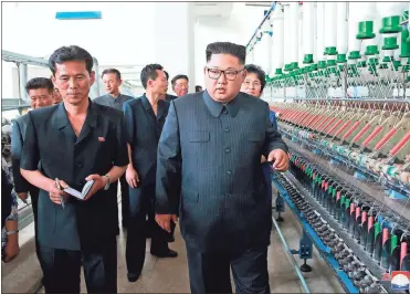  ?? / Korea News Service via AP ?? In this undated photo provided on July 2 by the North Korean government, North Korean leader Kim Jong Un, center, visits Sinuiju Chemical Fibre Mill in Sinuiju, North Korea. Independen­t journalist­s were not given access to cover the event depicted in...