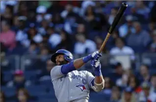  ?? ADAM HUNGER, GETTY IMAGES ?? Jose Bautista knocked in both runs in perhaps his last game with Toronto, which ended the year with a 76-86 record.