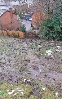  ?? ?? ●●Water flooding the field above Sue’s house (left). In the distance you can see it streaming across the road in front of the houses.