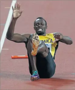  ??  ?? DESGRACIA. Usain Bolt, en el momento de lesionarse en el 4x100.