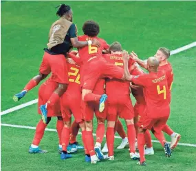  ?? GETTY IMAGES ?? Belgium's players celebrate after coming back from a 2-0 deficit to beat Japan, 3-2, on Monday and advance to the World Cup quarterfin­als.