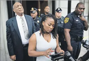  ?? AP PHOTO ?? Bill Cosby listens to his wife Camille’s statement being read aloud by Ebonee M. Benson outside the Montgomery County Courthouse after a mistrial in his sexual assault case in Norristown, Pa., Saturday. Cosby’s trial ended without a verdict after...