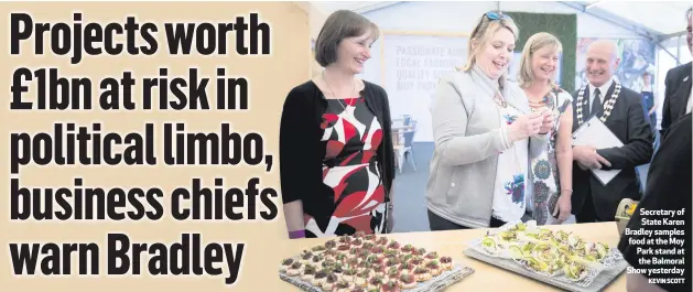  ?? KEVIN SCOTT ?? Secretary of State Karen Bradley samples food at the Moy Park stand at the Balmoral Show yesterday