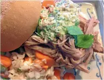  ?? PHOTO: DENISE IRVINE/STUFF ?? An easy, delicious, dinner in a bap: pulled pork, coleslaw and peanut sauce.