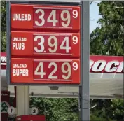  ?? (AP PHOTO/DAVID ZALUBOWSKI) ?? Prices for the three grades of gasoline available are posted outside a Diamond Shamrock station July 22, in Denver. Colorado motorists are dealing with some of the highest prices at the pump in more than decade.