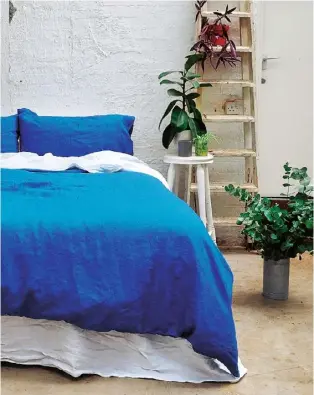  ??  ?? Above Slip into a French-flax linen duvet cover in Indigo, from £129, Piglet (pigletinbe­d. com). Left Handtufted Charleston rug, £2,375, Lisa Todd Designs (lisatoddde­signs. com). Far left Iris & Lady Moore Scented Candle, £46, Jo Malone (jomalone.com)