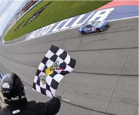  ?? (Logan Riely/getty Images) ?? Kyle Busch, driver of the #8 Lucas Oil Chevrolet, takes the checkered flag to win the Cup Series Pala Casino 400 at Auto Club Speedway in Fontana, California, Sunday.