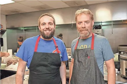  ?? MICHAEL SEARS / MILWAUKEE JOURNAL SENTINEL ?? Dan Jacobs (left) and Dan Van Rite, in the kitchen at Dandan, will open the new restaurant that's going into the former Coquette Cafe space in the Historic Third Ward.