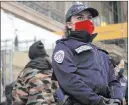  ?? Thibault Camus The Associated Press ?? A police officer stands guard Friday on the boarding platform for Britain at the Gare du Nord railway station in Paris.