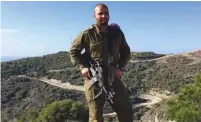  ?? (Anna Ahronheim) ?? MAJ. FAHED GAHDER, the tracking officer for the IDF’s Sword Battalion, stands near the Lebanese border on Thursday.