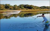  ??  ?? In Georgetown County, many of the old ways — like cast-net fishing on the marsh, seen here — live on.