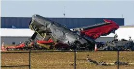  ?? LM OTERO / AP ?? Debris litters the area after two planes crashed during an air show at Dallas Executive Airport on Saturday. Investigat­ors are examining debris and equipment.