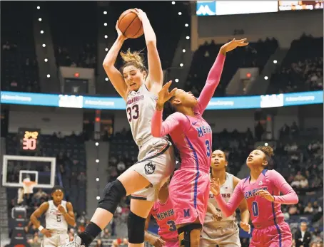  ?? Jessica Hill / Associated Press ?? UConn’s Katie Lou Samuelson grabs a rebound over Memphis’ Ashia Jones, right, during Wednesday’s game in Hartford.