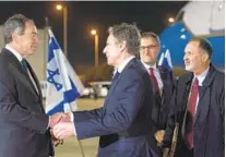  ?? JACQUELYN MARTIN AP ?? U.S. Ambassador to Israel Thomas Nides (left) greets Secretary of State Antony Blinken in Tel Aviv, Israel, on Saturday.