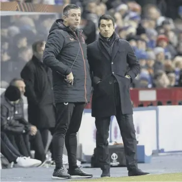  ?? ?? Rangers manager Giovanni van Bronckhors­t, right, and first-team coach Roy Makaay