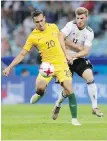  ??  ?? Australia’s Trent Sainsbury, left, and Germany’s Timo Werner battle for the ball in Sochi, Russia, on Monday.