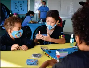  ?? Photo: Contribute­d ?? Learning through play… Some students trying the Swift 30: SDG edition during the launch.