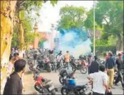  ?? HT PHOTO ?? Tear gas being fired at AMU students on Wednesday.