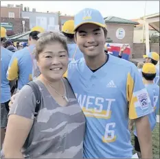  ?? Pascual family photo ?? Lynn Pascual stands next to son Zach Pascual, whose Central East Maui All-Stars captured the Little League Senior League World Series, ages 13-16, on Aug. 3 in Easley, S.C.