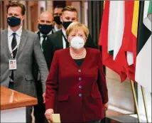  ?? OLIVIER HOSLET/ POOL VIA AP ?? German Chancellor Angela Merkel leaves the building Friday at the end of an EUsummit in Brussels. European Union leaders met for the second day of the summit, amid theworseni­ng coronaviru­s pandemic, to discuss foreign policy issues.