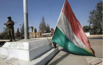  ?? AHMAD AL-RUBAYE/AFP/GETTY IMAGES ?? The city of Kirkuk was secured this week by Iraqi forces after being in the hands of Kurdish separatist­s since 2014.