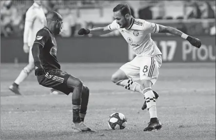  ?? [CHRIS SZAGOLA/THE ASSOCIATED PRESS] ?? The Crew’s Artur, right, tries to get past the Union’s Fafa Picault during the first half.