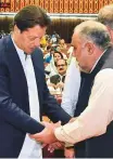  ?? AP ?? Imran Khan, left, greets speaker of the National Assembly Asad Qaiser in Islamabad, yesterday.