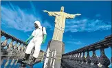  ?? AFP ?? Soldiers disinfect the area around the Christ The Redeemer statue in n
Rio de Janeiro. The site reopened to the public on Saturday.