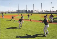  ?? Alex Trautwig / MLB Photos ?? The San Francisco Giants work out in their first spring training, in February at Scottsdale Stadium in Arizona.