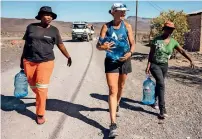  ?? AP ?? Mina Guli walks through drought-stricken Beaufort West, in South Africa. —