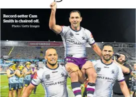  ?? Photo / Getty Images ?? Record-setter Cam Smith is chaired off.