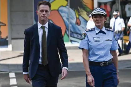  ?? Photograph: Ayush Kumar/AFP/Getty Images ?? Chris Minns and NSW police commission­er Karen Webb. The premier has expressed concern at the amount of misinforma­tion and violent imagery on social media.