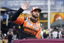  ?? MARK HUMPHREY — THE ASSOCIATED PRESS ?? Chase Elliott waves to fans as he is introduced before a NASCAR Cup Series race at Bristol Motor Speedway on Saturday.