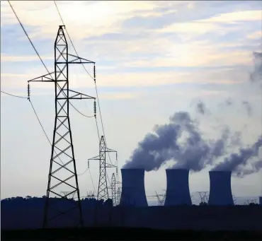  ?? PHOTO: EPA ?? An Eskom coal fired power station is seen as the sun rises near Johannesbu­rg in this file photo. Eskom refuses to budge on its zero percent wage increase offer.