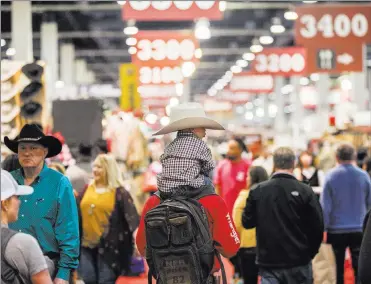  ?? Benjamin Hager Las Vegas Review-Journal ?? Shoppers pack the South Halls during Cowboy Christmas at the Las Vegas Convention Center.