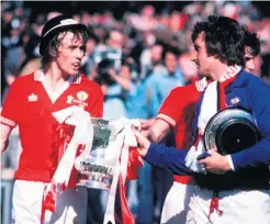  ??  ?? Prize day: Sammy Mcilroy with goalkeeper Alex Stepney after the 1977 FA Cup final win over Bob Paisley’s Liverpool