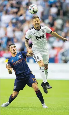  ?? GERRY KAHRMANN ?? Jordan Harvey, in white, seen in action last year, was a fixture on the Whitecaps’ back line for seven years. The 34-year-old California native is the all-time MLS leader in starts and minutes played.
